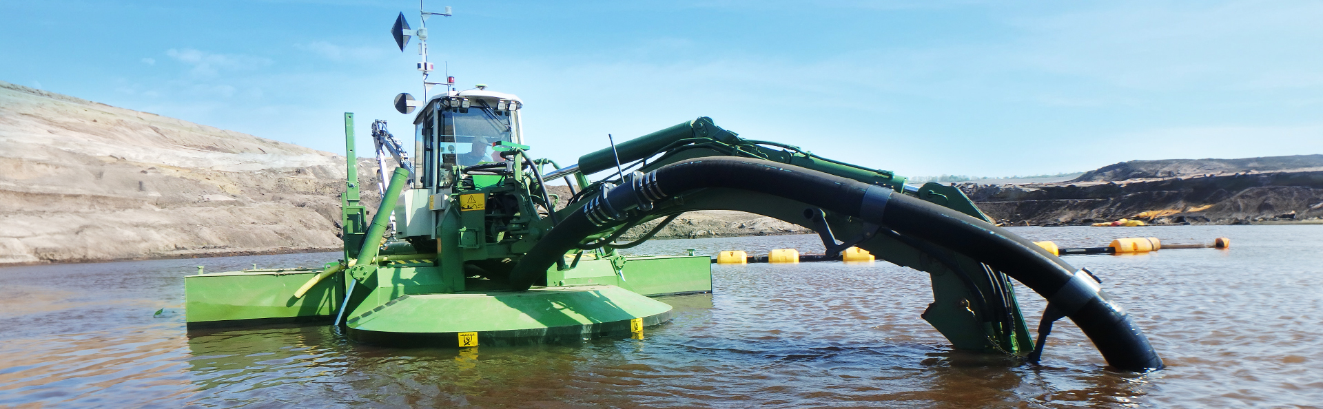 The Watermaster amphibious multipurpose dredger working in shallow water